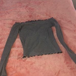 Off the shoulder, ribbed long sleeved shirt.